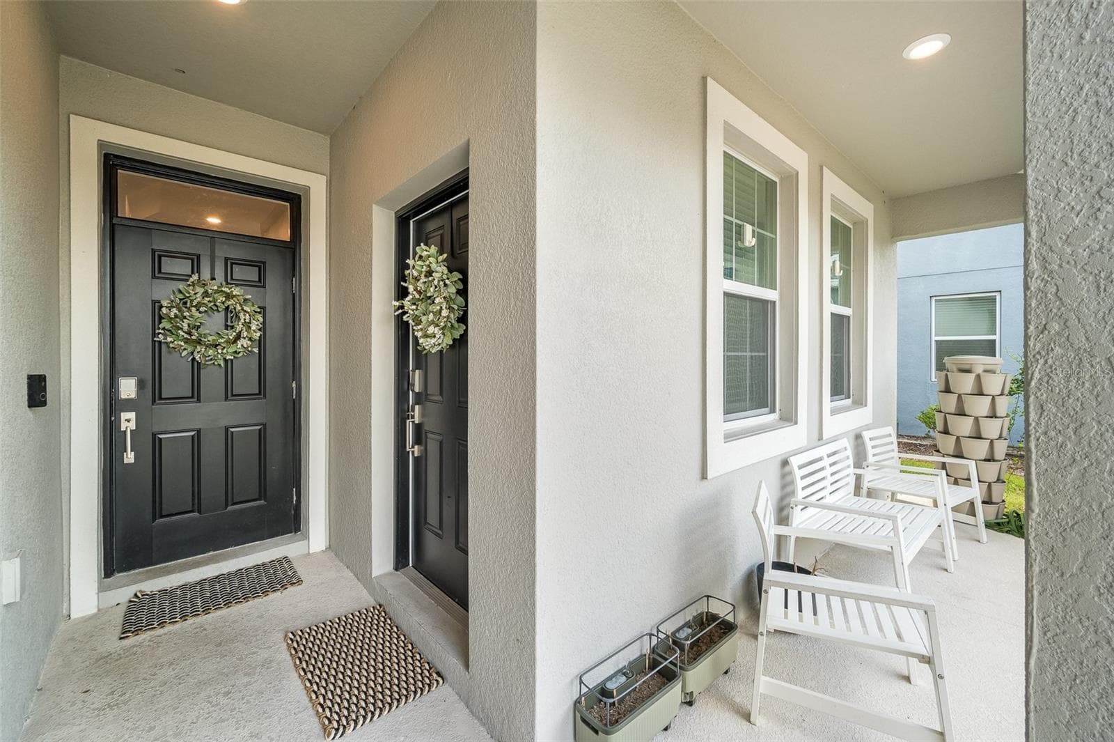 Two front entry doors; second entry for multi-gen suite - 2353 CRESCENT MOON ST, KISSIMMEE