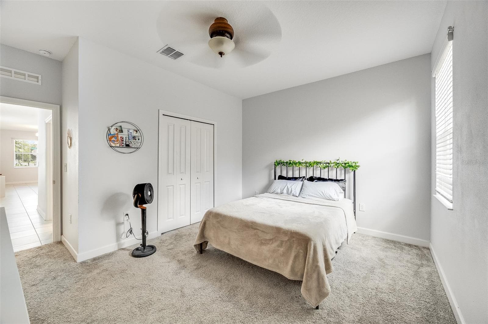 Downstairs primary bedroom suite; bedroom 5 of 5 - 2353 CRESCENT MOON ST, KISSIMMEE