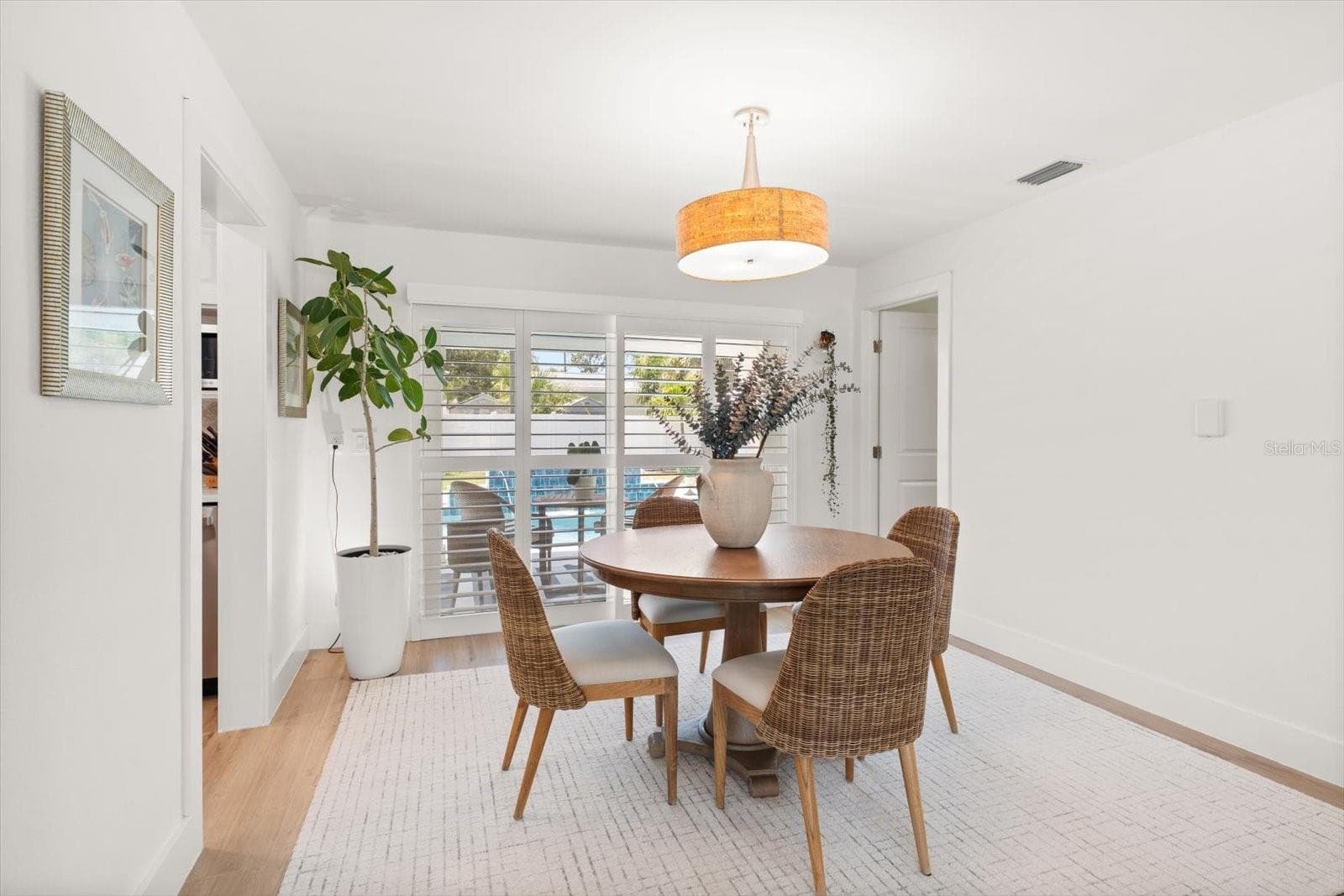 Dining Room looking oout over the beautiful Pool and Patio. - 821 JACARANDA DR, LARGO