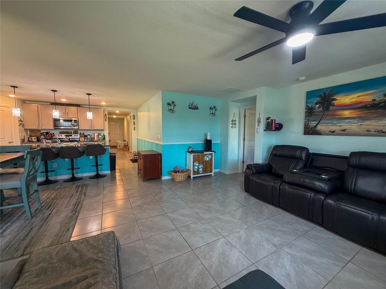 LIVING ROOM WITH KITCHEN VIEW - 4120 QUIET RAIN CT, PALMETTO