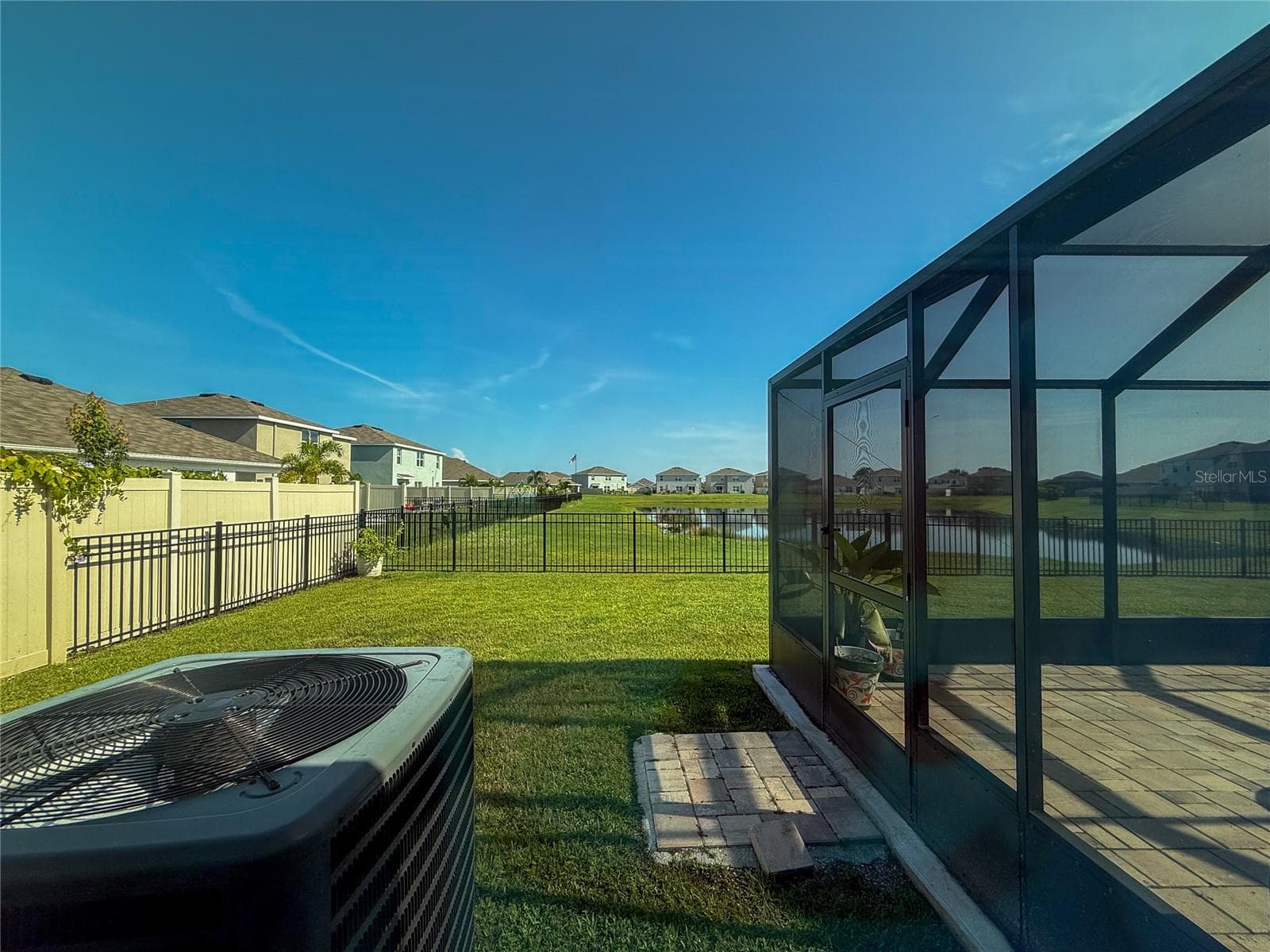 VIEW OF BACKYARD AND POND FROM PRIMARY BEDROOM - 4120 QUIET RAIN CT, PALMETTO