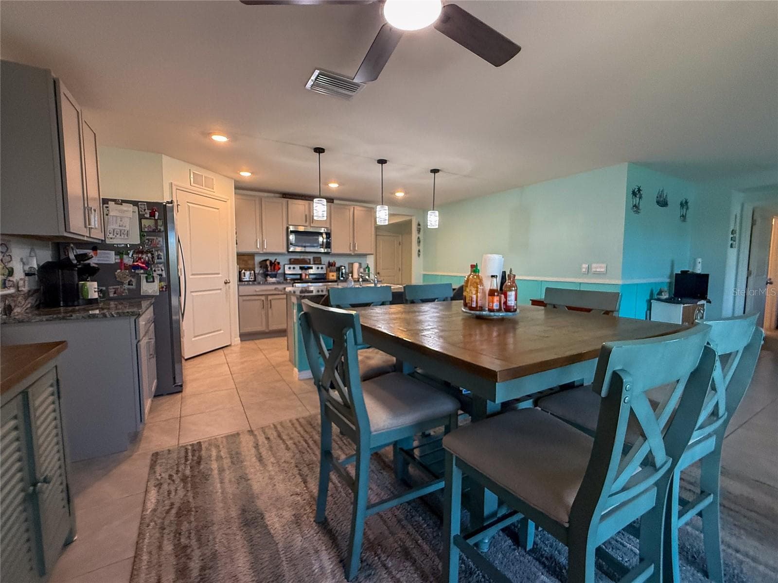 DINING ROOM WITH KITCHEN VIEW - 4120 QUIET RAIN CT, PALMETTO