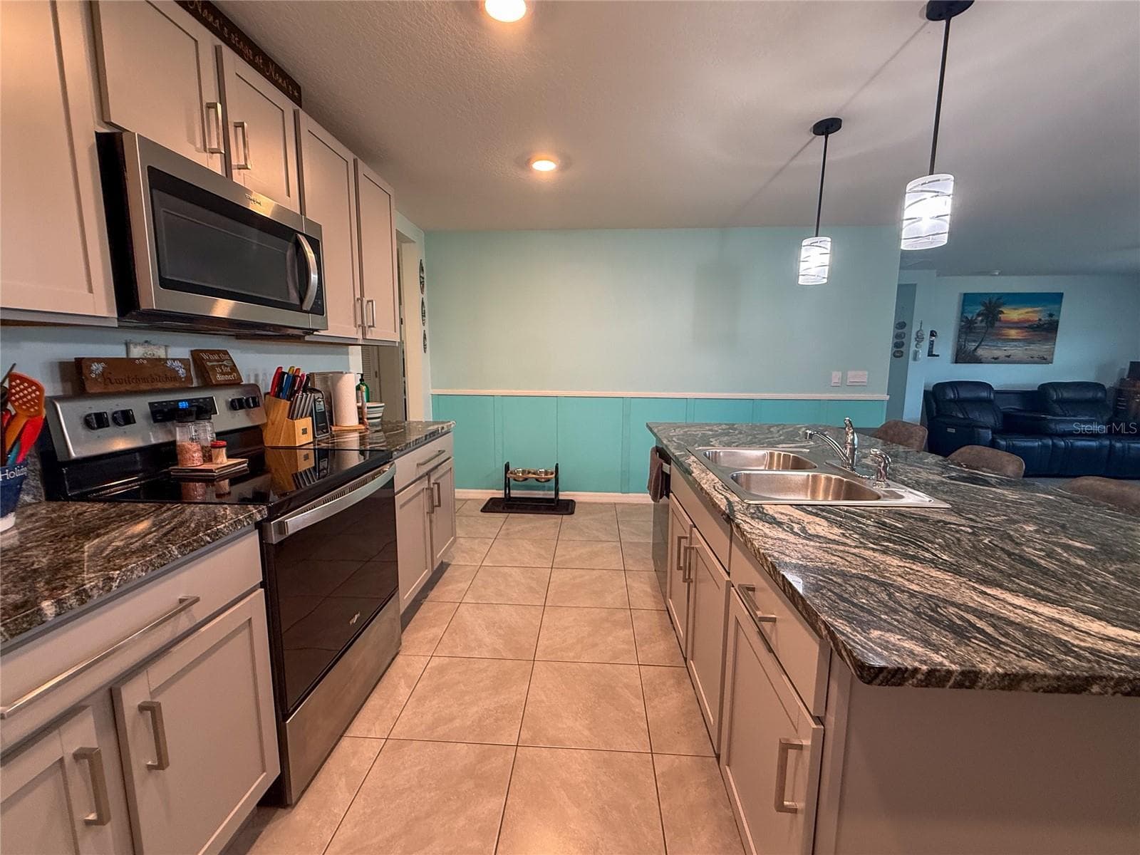 KITCHEN WITH VIEW OF LIVING ROOM - 4120 QUIET RAIN CT, PALMETTO
