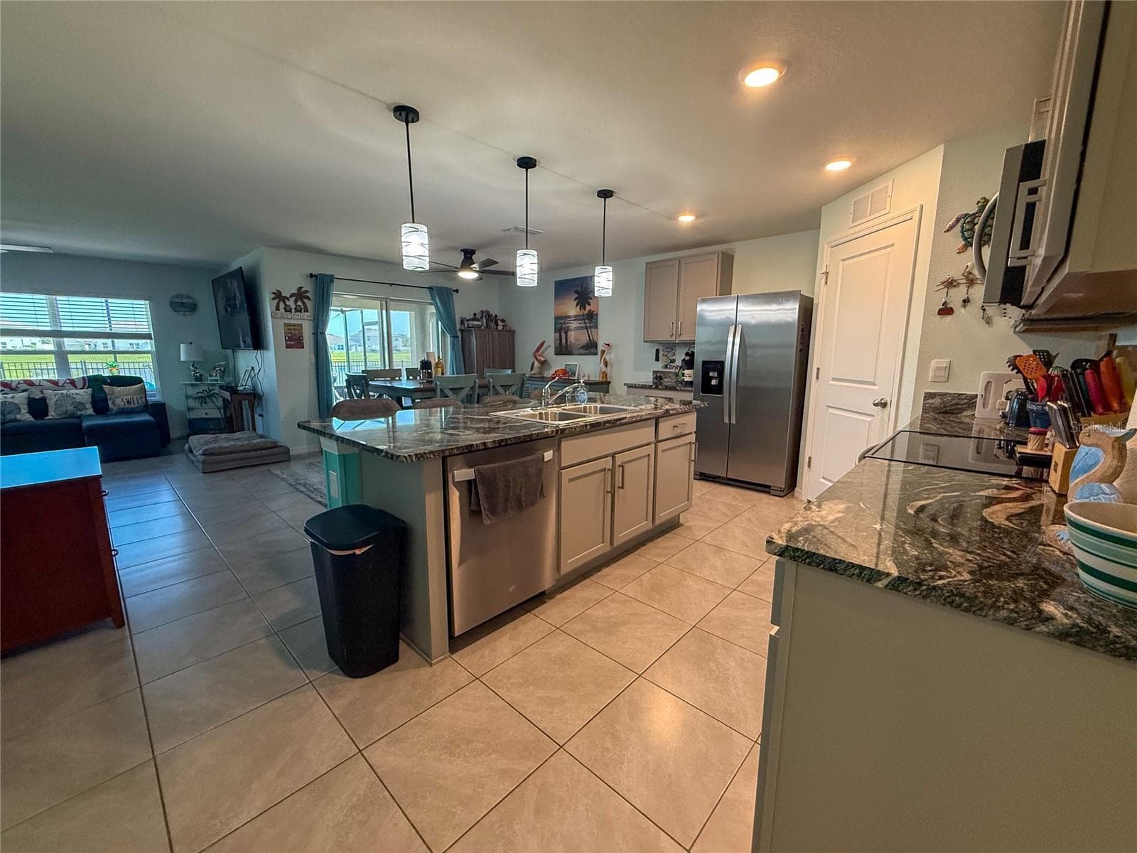 KITCHEN WITH VIEW OF LIVING ROOM - 4120 QUIET RAIN CT, PALMETTO