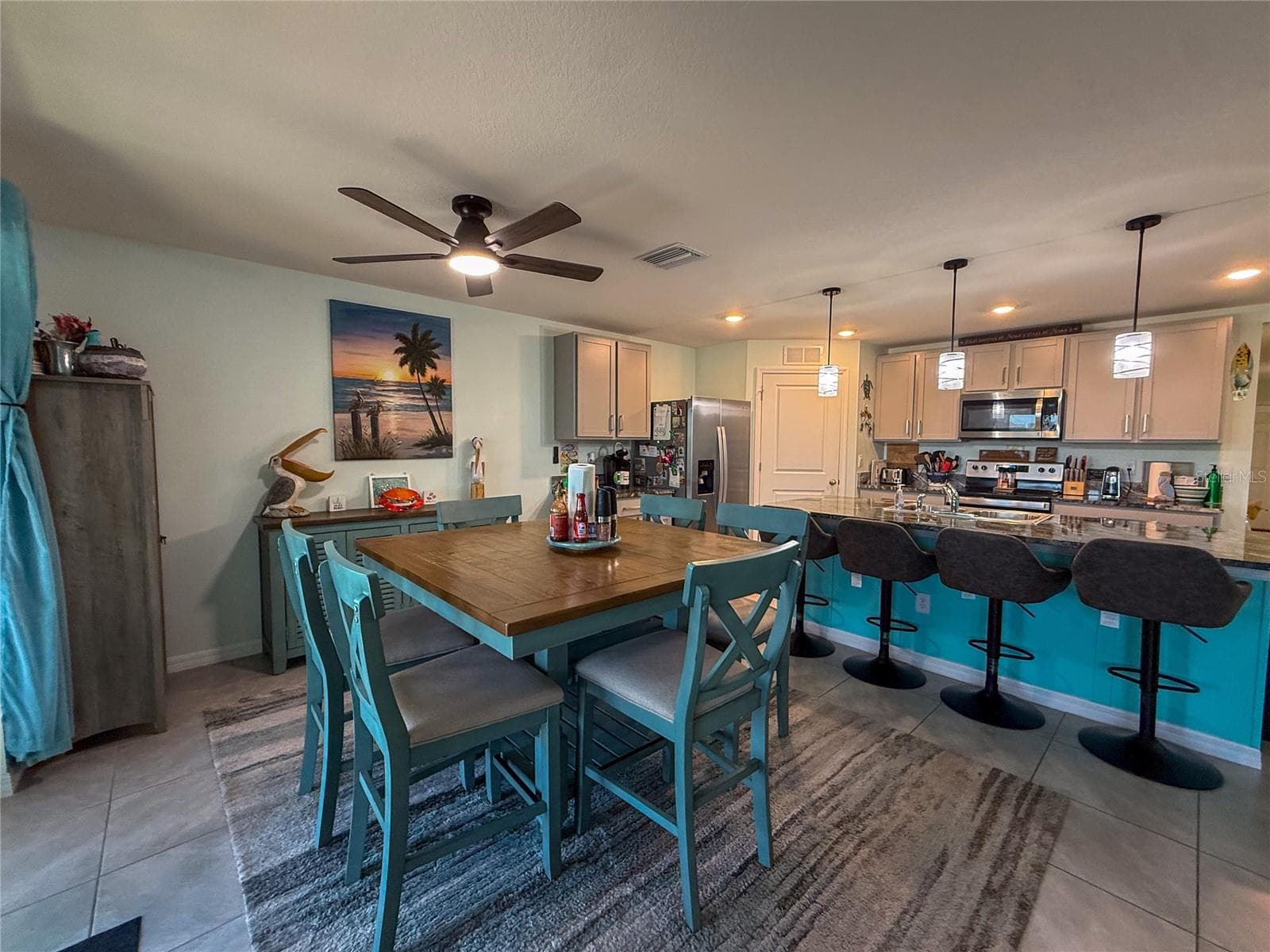 DINING ROOM WITH KITCHEN VIEW - 4120 QUIET RAIN CT, PALMETTO