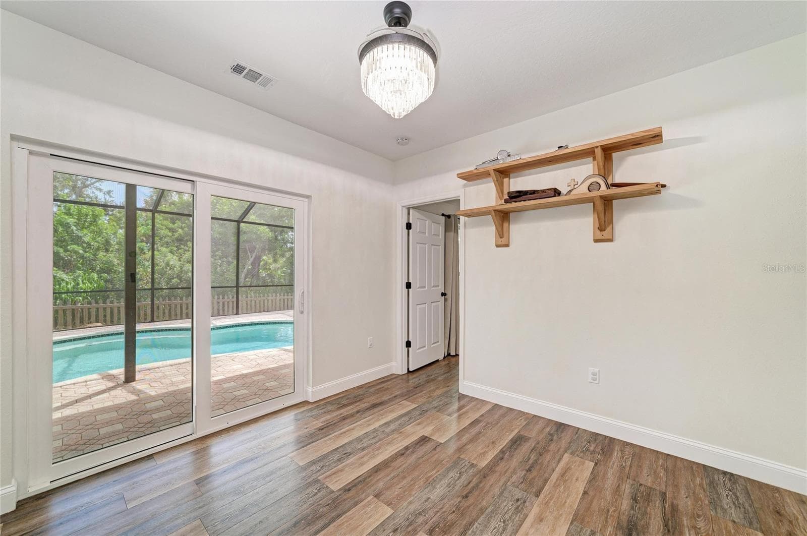 Eat-in dining space with views of pool from the new sliding door. - 3220 37TH TER E, BRADENTON