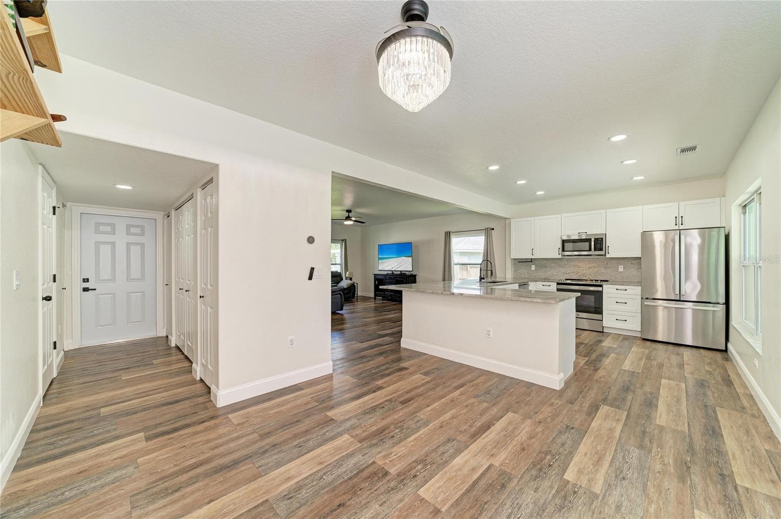Indoor laundry and half bath located in first floor hallway. - 3220 37TH TER E, BRADENTON