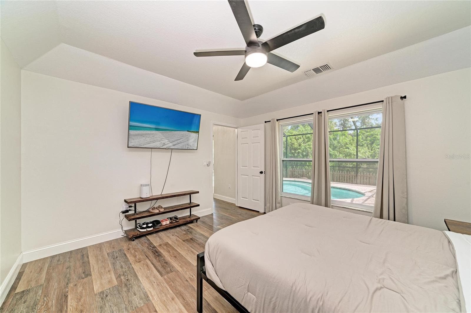 Primary bedroom is on first floor with ensuite bathroom and walk-in closet. - 3220 37TH TER E, BRADENTON