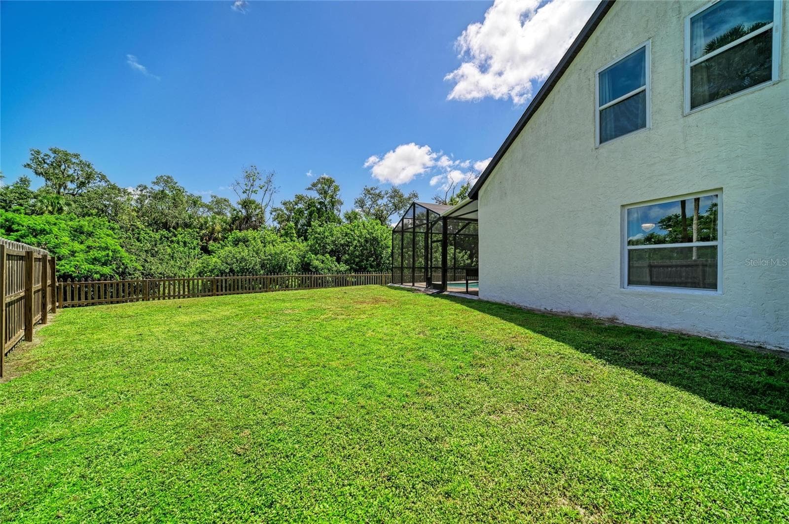 Backyard fence has double gate and room to park a boat. - 3220 37TH TER E, BRADENTON