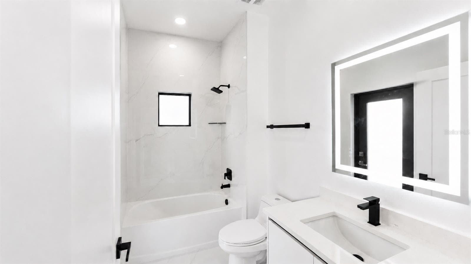 2nd Bathroom with Pool Entrance - 1310 S WAPELLO ST, NORTH PORT