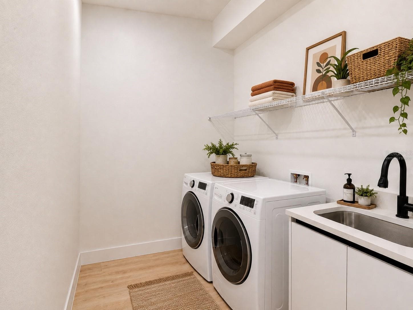 Virtually Staged Laundry Room with Washer & Dryer - 1310 S WAPELLO ST, NORTH PORT