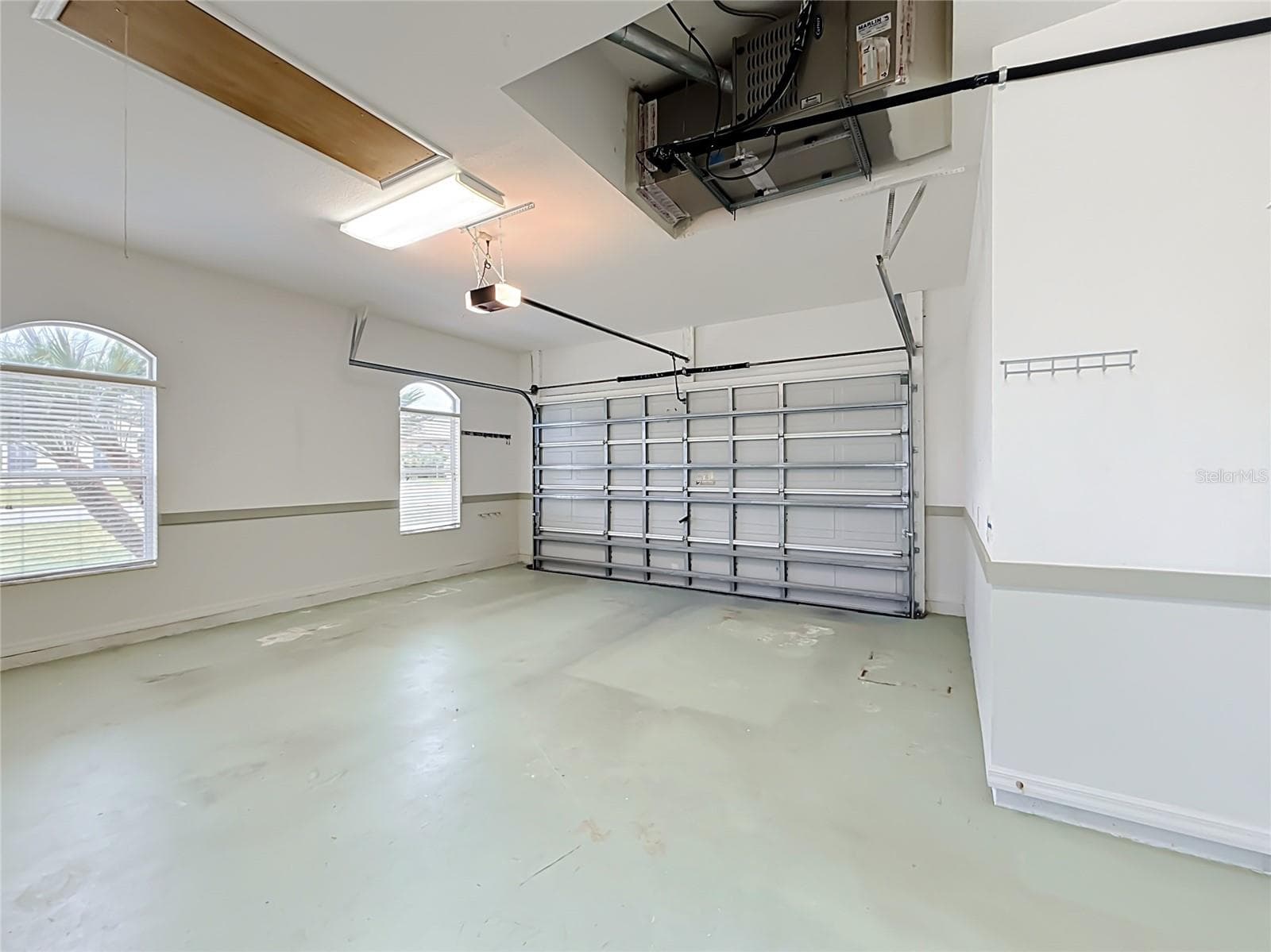 Garage with keypad. - 11932 SE 179TH ST, SUMMERFIELD