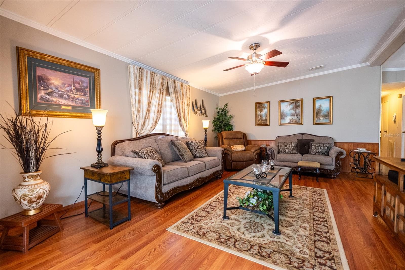 MAIN LIVING ROOM- FURNITURE INCLUDED - 6703 CANTERBURY DR NE, WINTER HAVEN