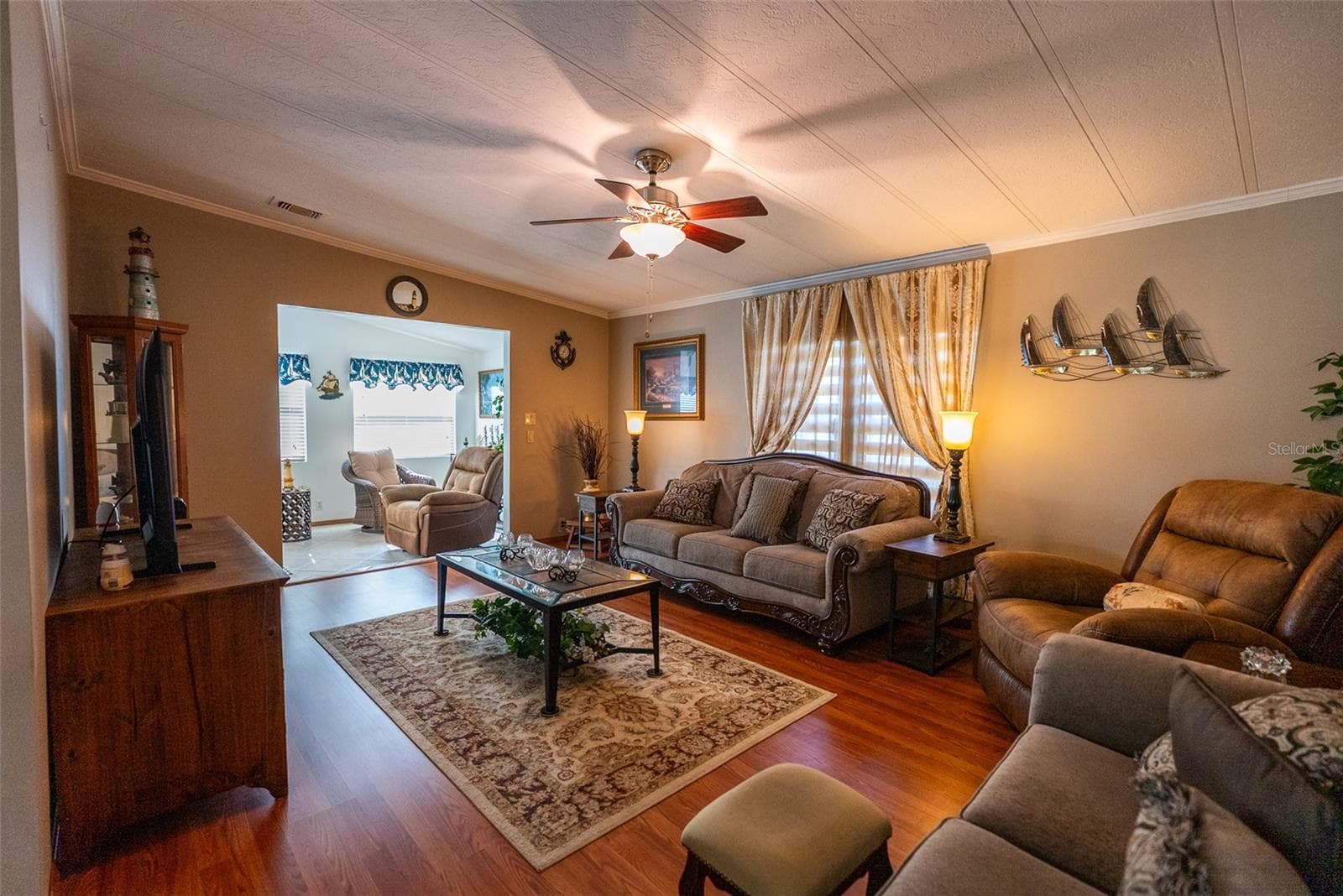 MAIN LIVING ROOM- FURNITURE INCLUDED - 6703 CANTERBURY DR NE, WINTER HAVEN
