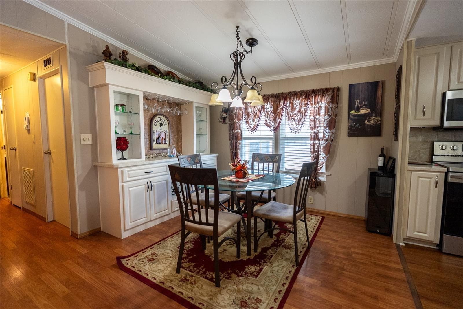 DINING ROOM WITH BUILT-INS - 6703 CANTERBURY DR NE, WINTER HAVEN