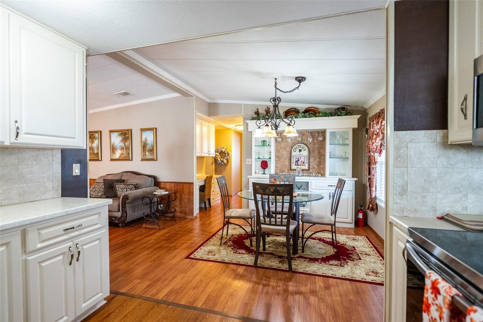 DINING ROOM WITH BUILT-INS - 6703 CANTERBURY DR NE, WINTER HAVEN
