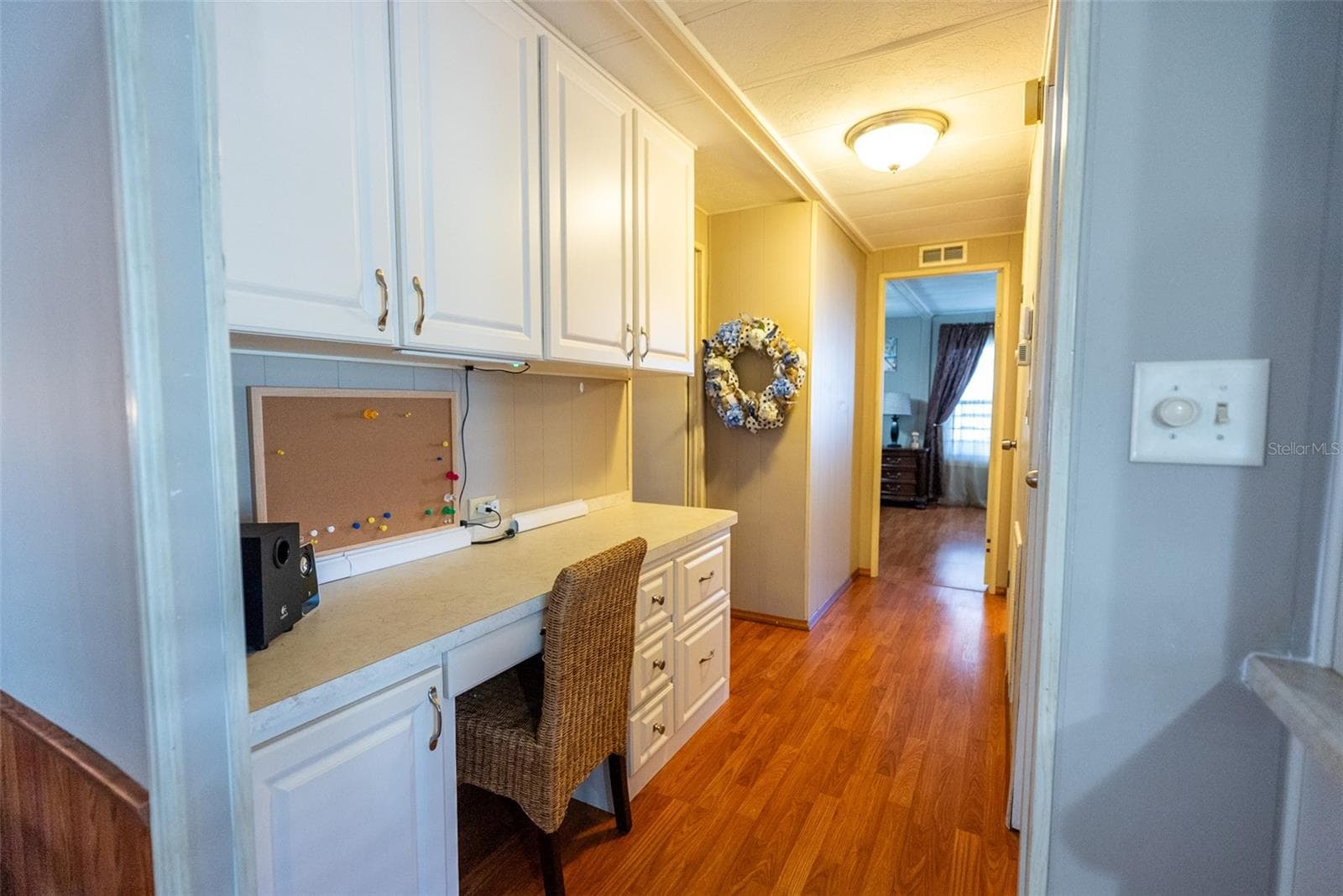 HALLWAY TO MASTER BEDROOM WITH BUILT-INS - 6703 CANTERBURY DR NE, WINTER HAVEN