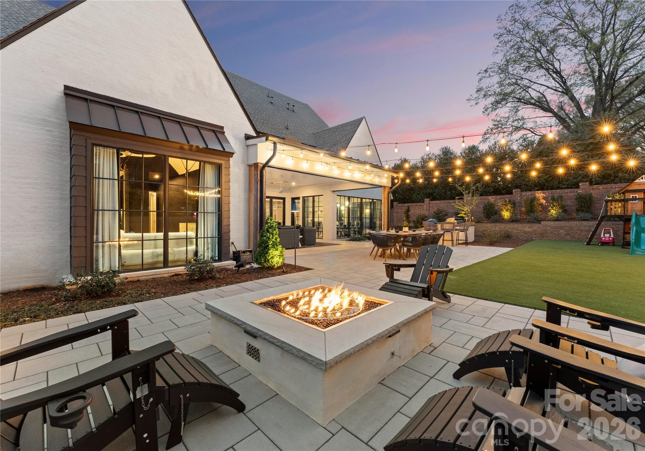 Imagine all the cozy fall evenings to be had gathered around the fire pit. - 2610 Sedley Road, Charlotte