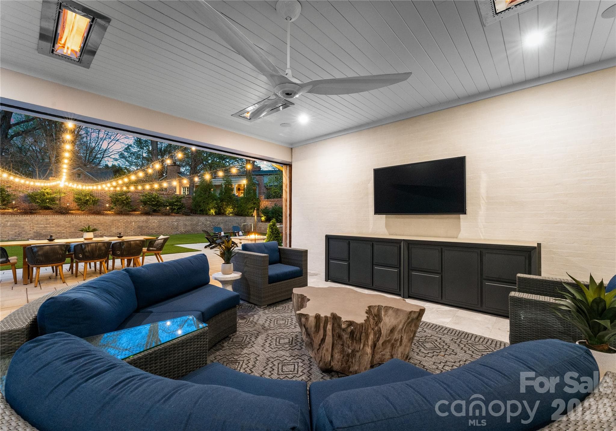 Covered patio with motorized patio screens and 4 Infratech ceiling heaters. - 2610 Sedley Road, Charlotte