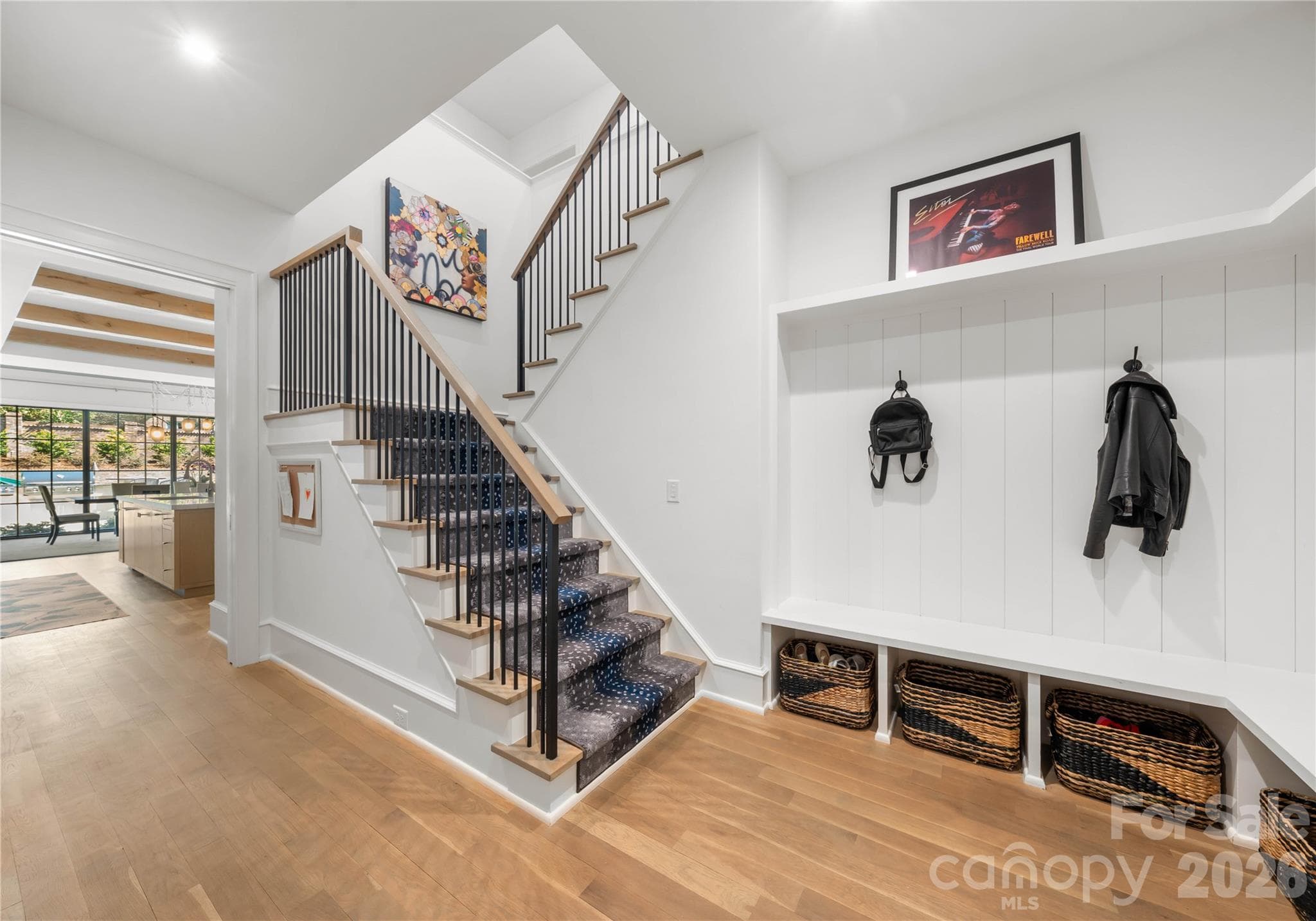 Drop zone area off garage entry and secondary staircase. Offers a built in desk, additional coat closet and a pocket door to close it off from the kitchen if needed! - 2610 Sedley Road, Charlotte