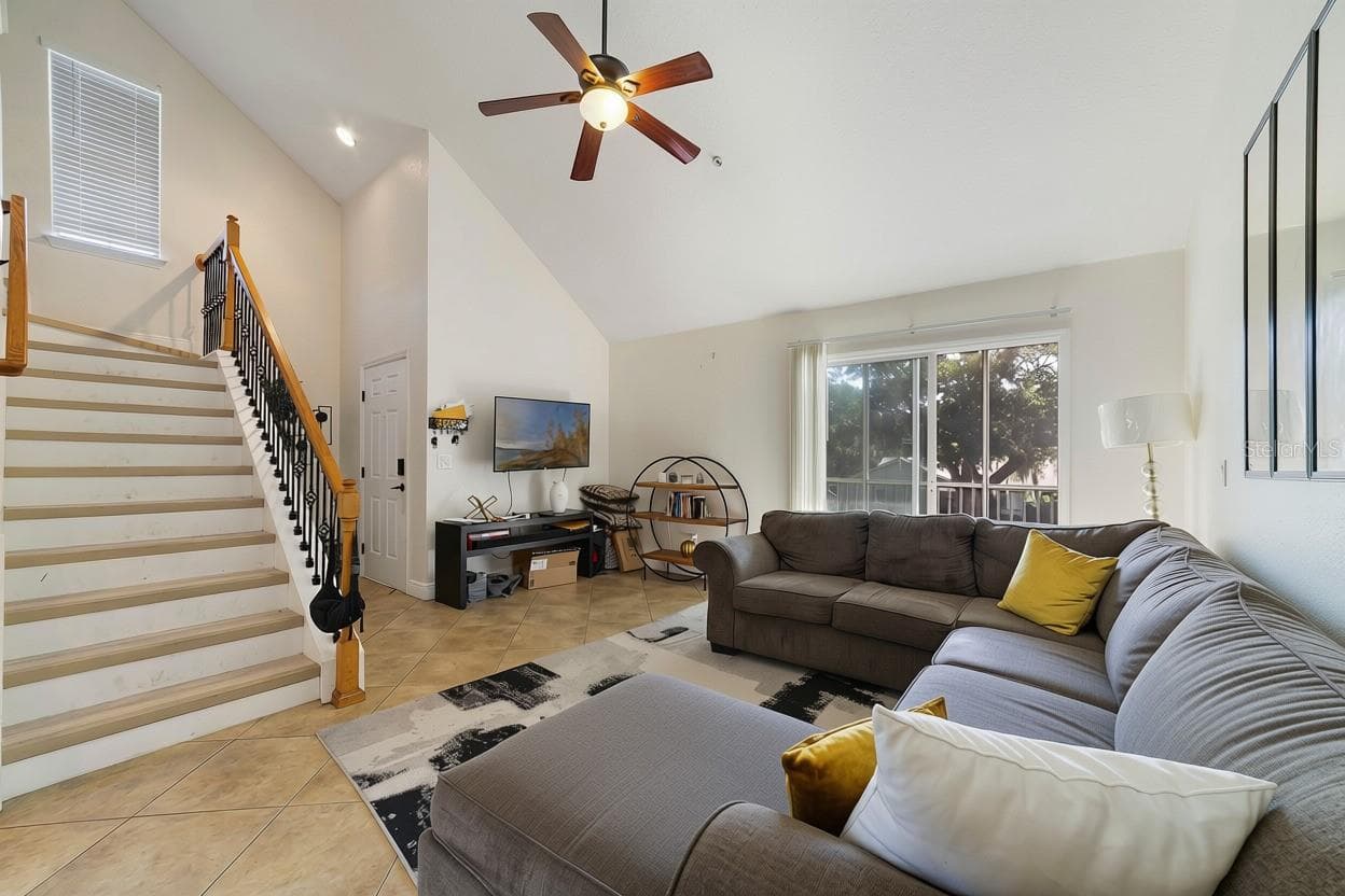 The stairs are a prominent feature with beautiful iron accents - 3721 S LAKE ORLANDO PKWY #8, ORLANDO