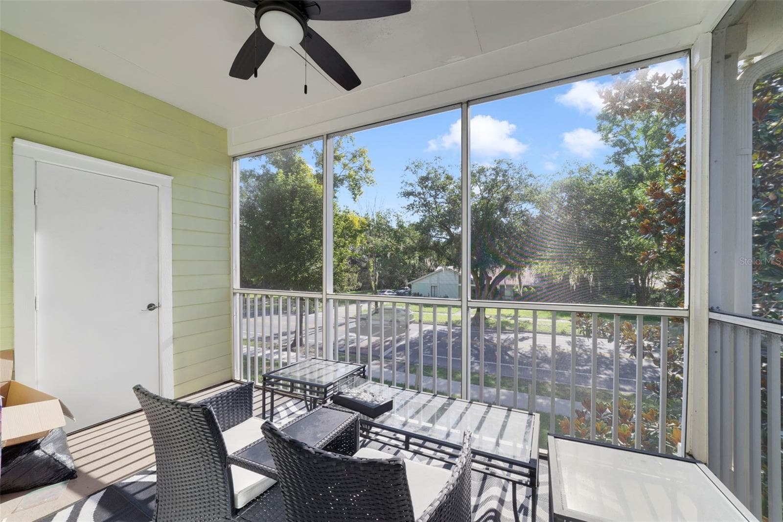 Enjoy relaxing on your screened-in patio with outside storage and a ceiling fan! - 3721 S LAKE ORLANDO PKWY #8, ORLANDO
