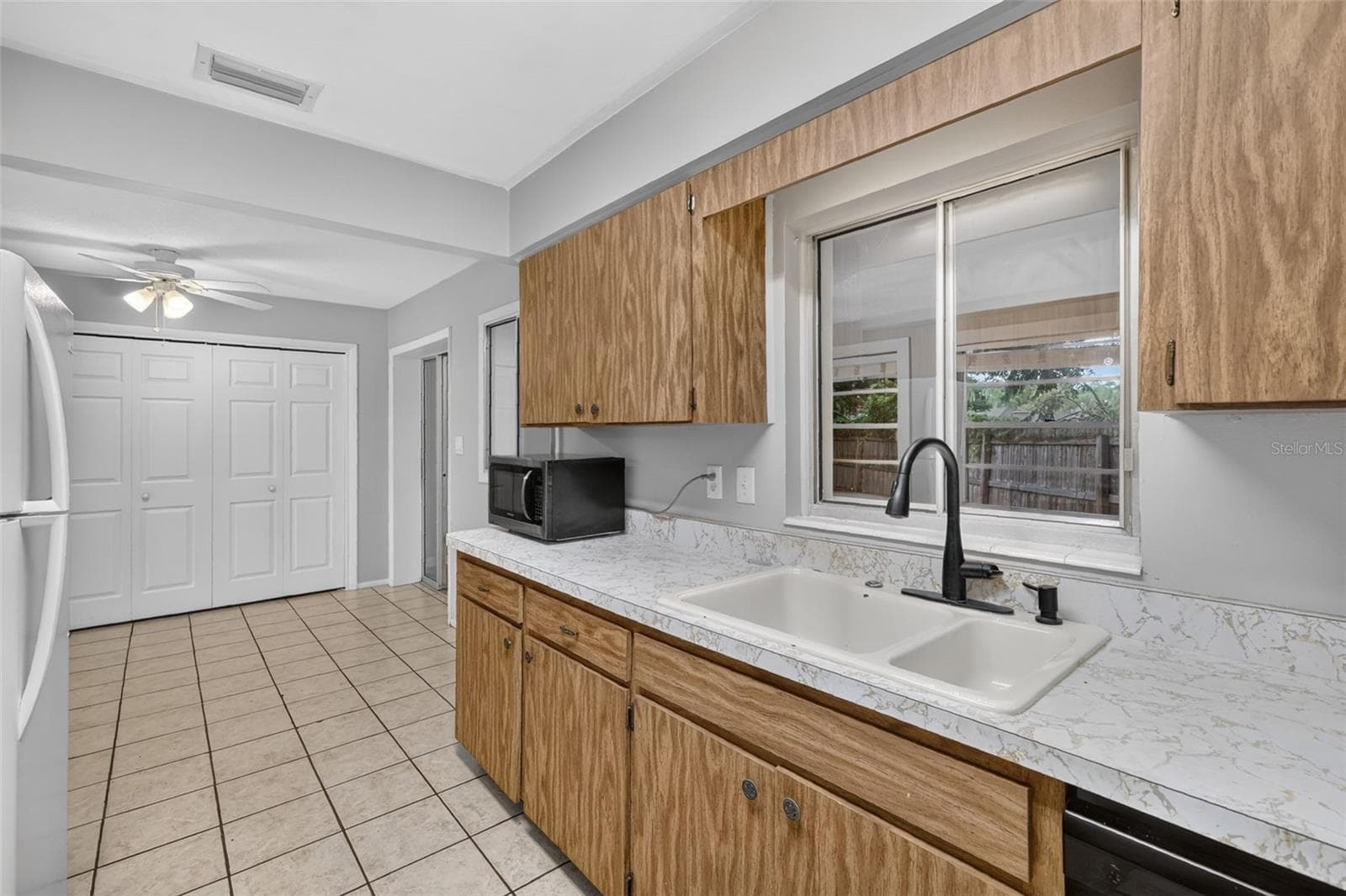 Dining Area Conveniently Located Next to Kitchen-Window View/Access Into Florida Room From Kitchen - 1305 ORANGE AVE, TAVARES