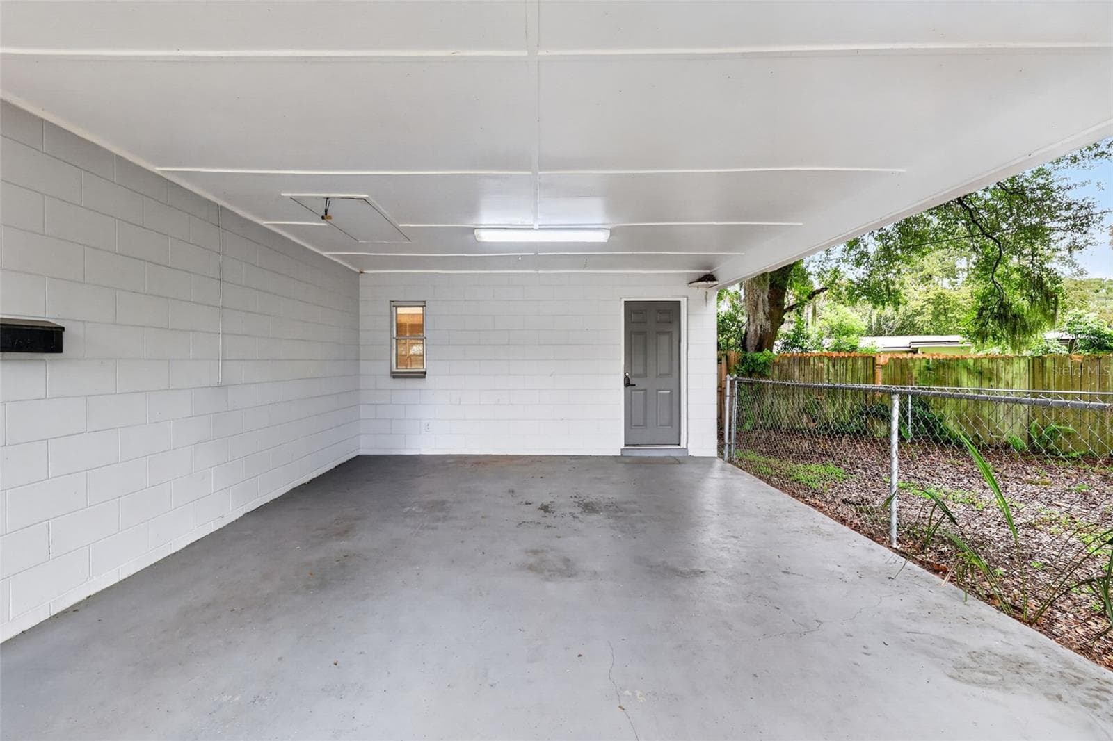 Nice Covered Carport With Convenient Side Entry To The Home - 1305 ORANGE AVE, TAVARES