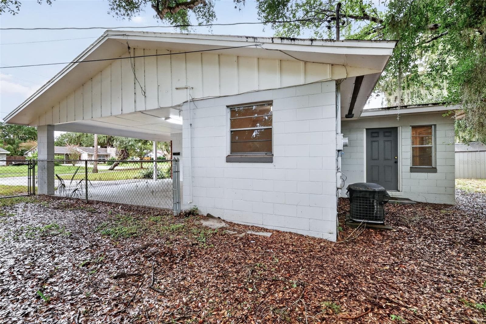 Exterior Side View of the Home/Covered Carport - 1305 ORANGE AVE, TAVARES