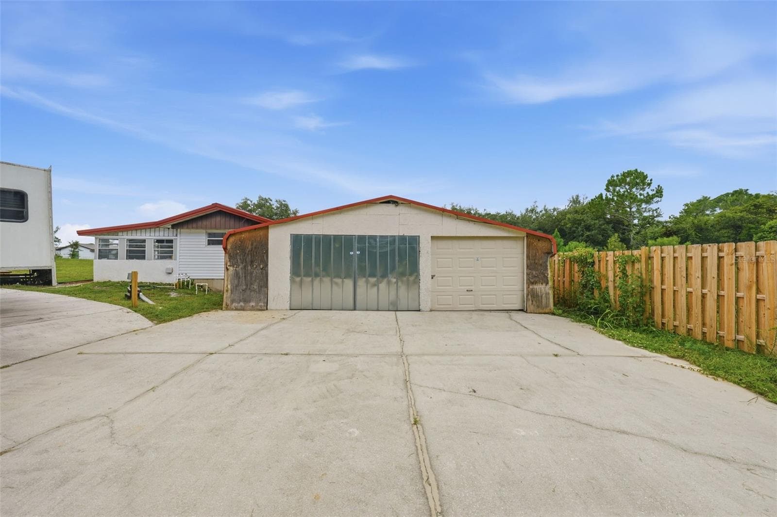 3 Bay metal pole barn with parking pad - 44945 2ND ST, DELAND