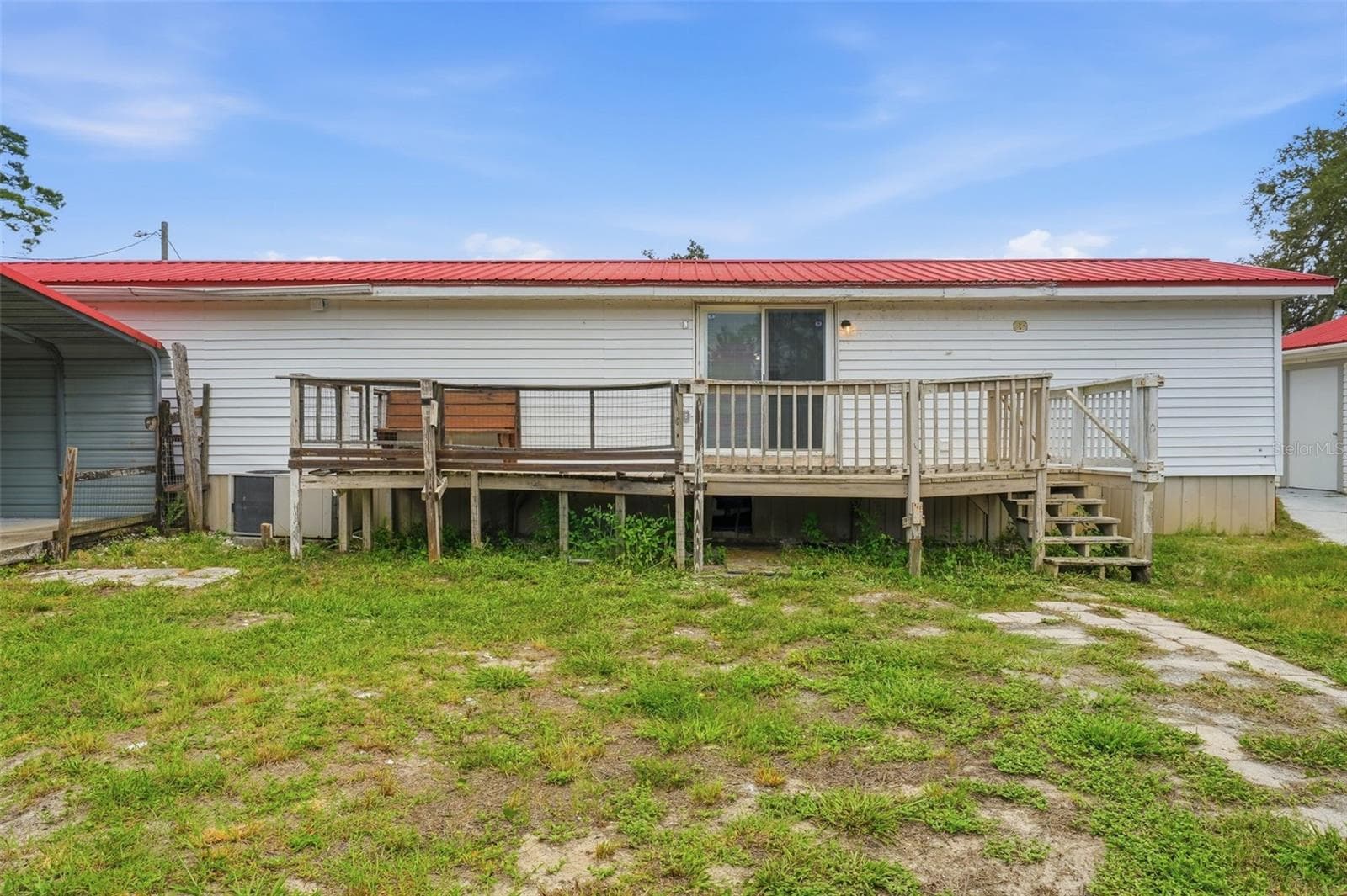 rear of the home showing the back deck - 44945 2ND ST, DELAND
