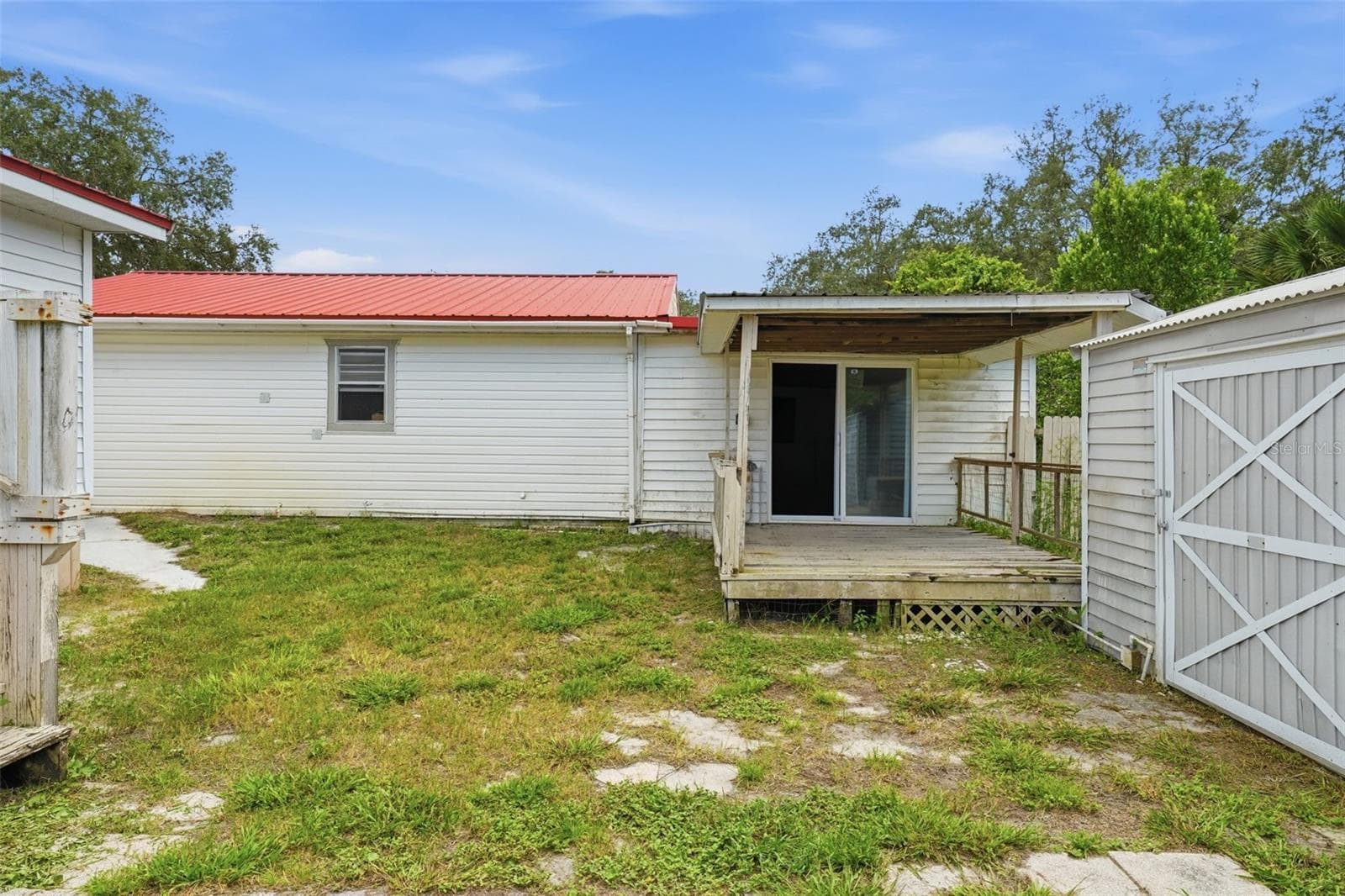 sliding doors and deck off of the bonus area behind the garage - 44945 2ND ST, DELAND