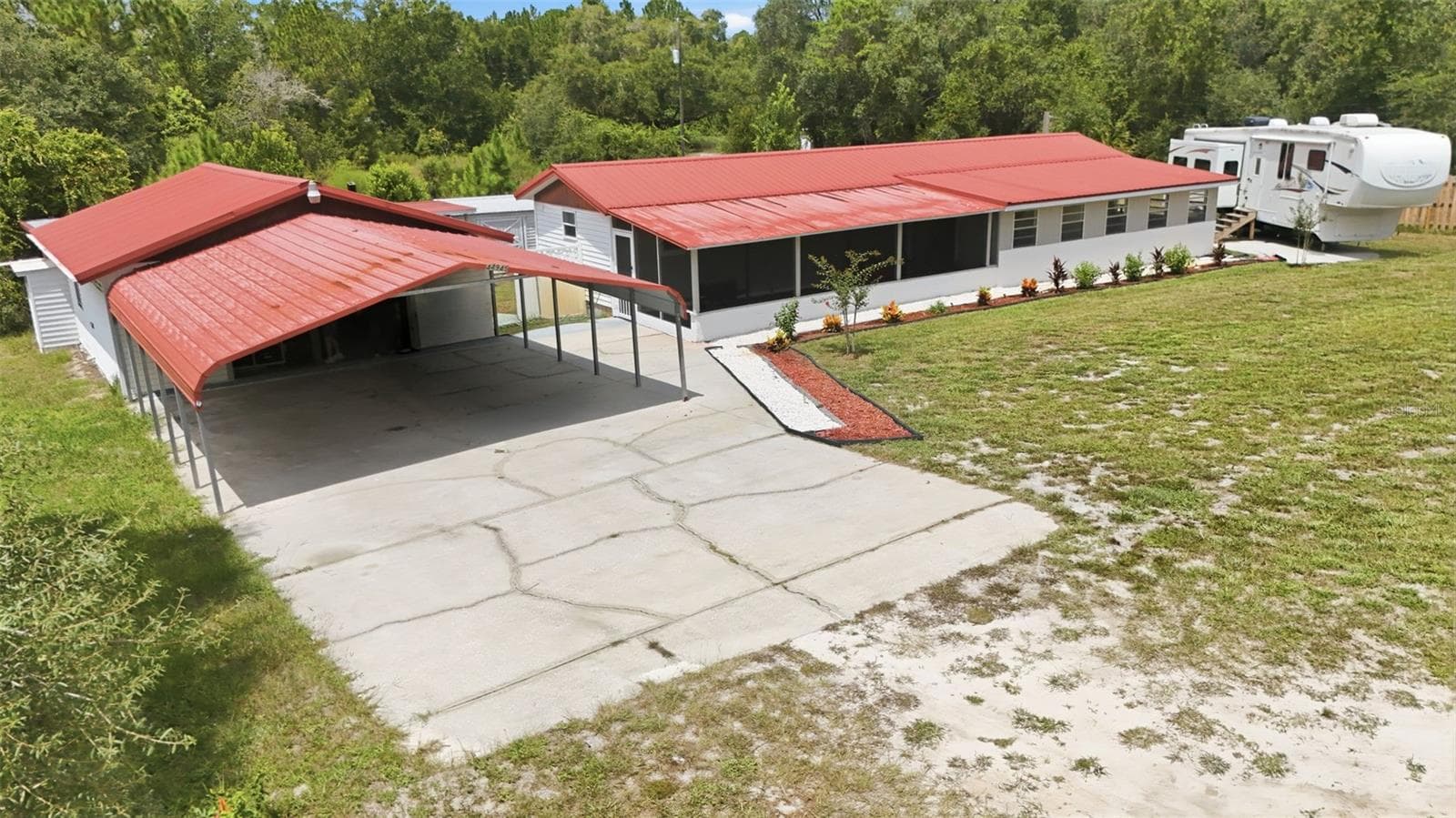 large 2 car carport and pad in front of the garage - 44945 2ND ST, DELAND