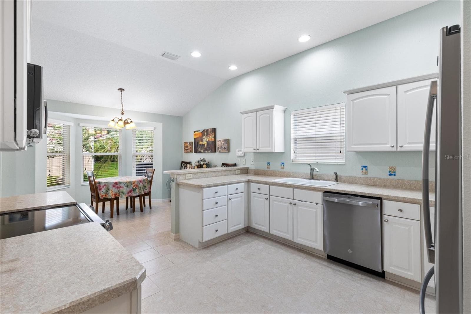 Spacious Kitchen with light cabinets and abundant counterspace. - 2494 FLINTSHIRE AVE, THE VILLAGES