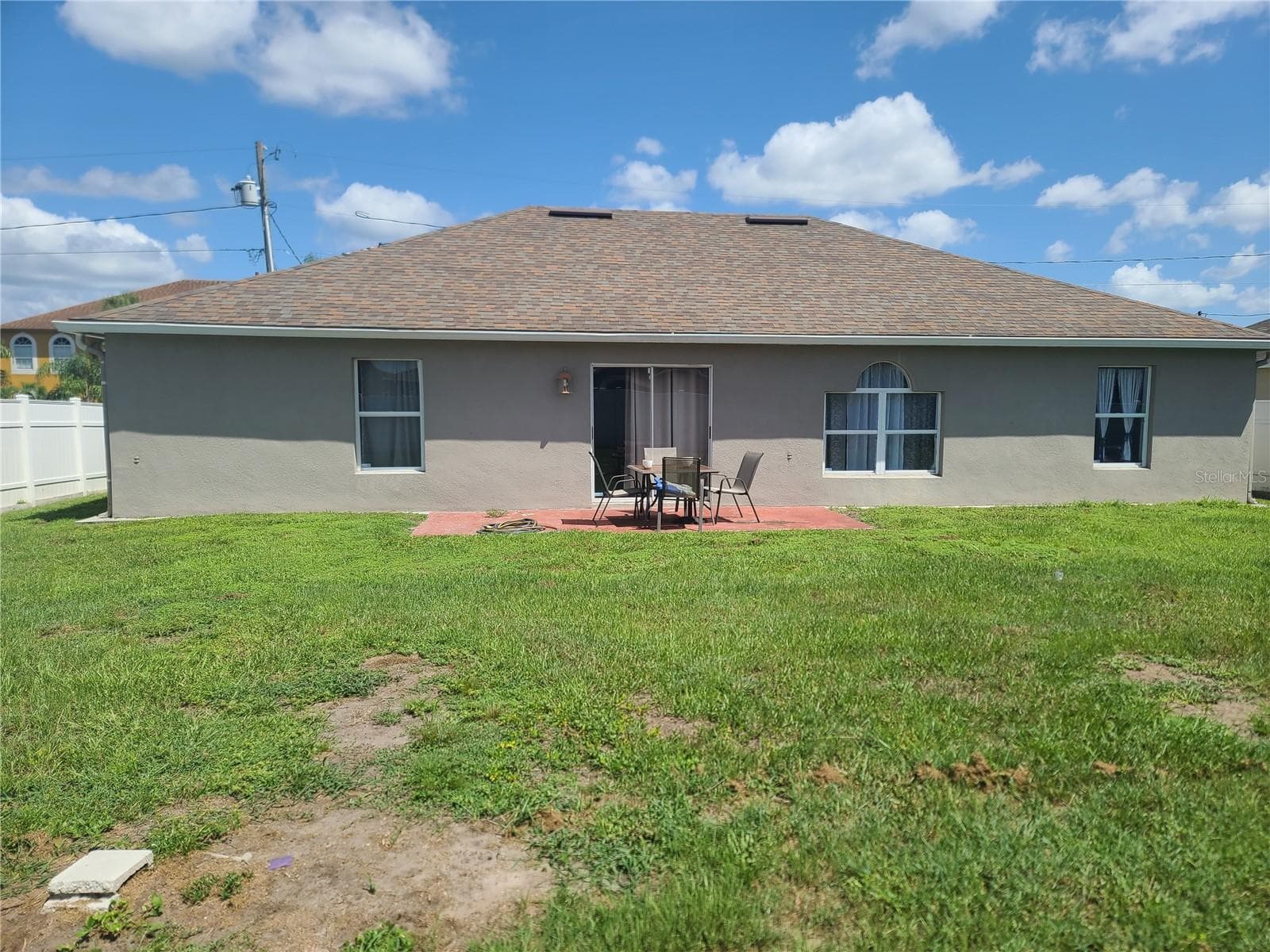 Fenced in backyard. - 149 AURORA LN, KISSIMMEE