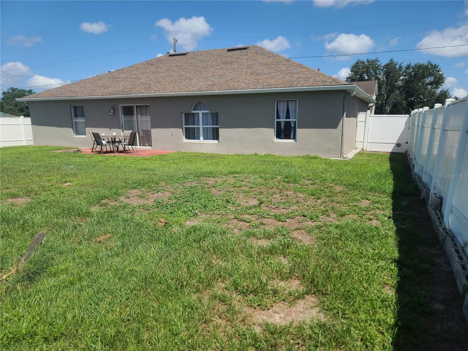 Fenced in backyard. - 149 AURORA LN, KISSIMMEE