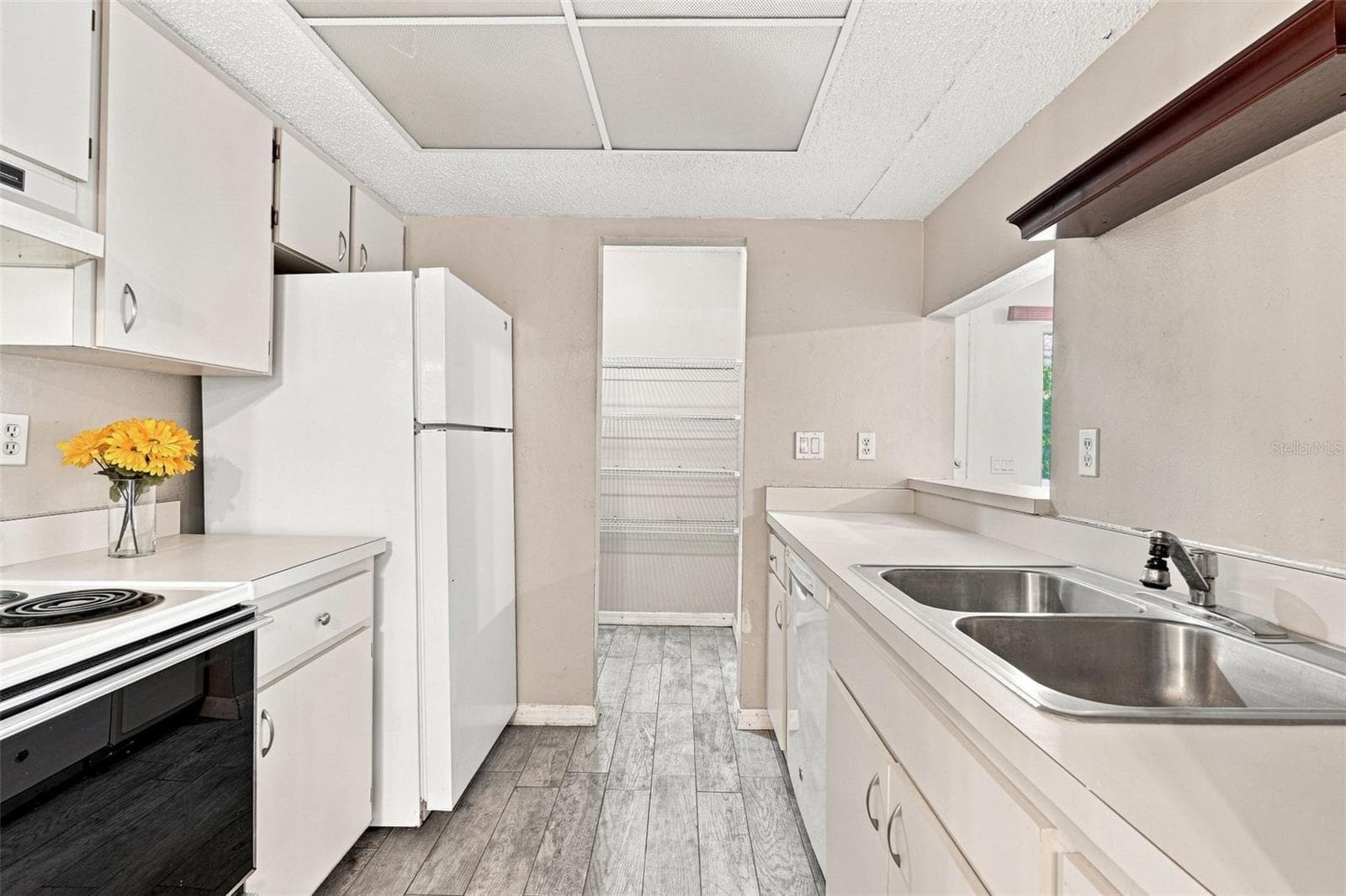Large Galley Kitchen With Walk In Pantry - 22278 VICK ST #A101, PORT CHARLOTTE
