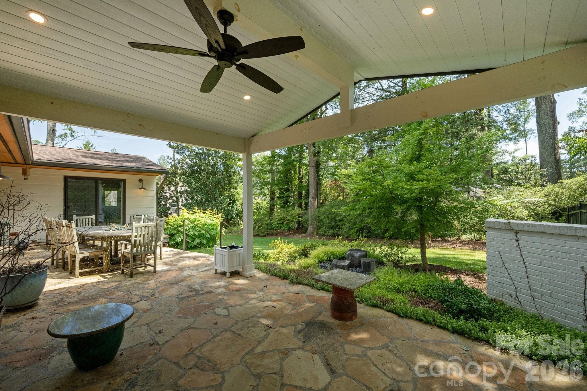 Covered patio overlooking water feature - 28 Forest Road, Asheville