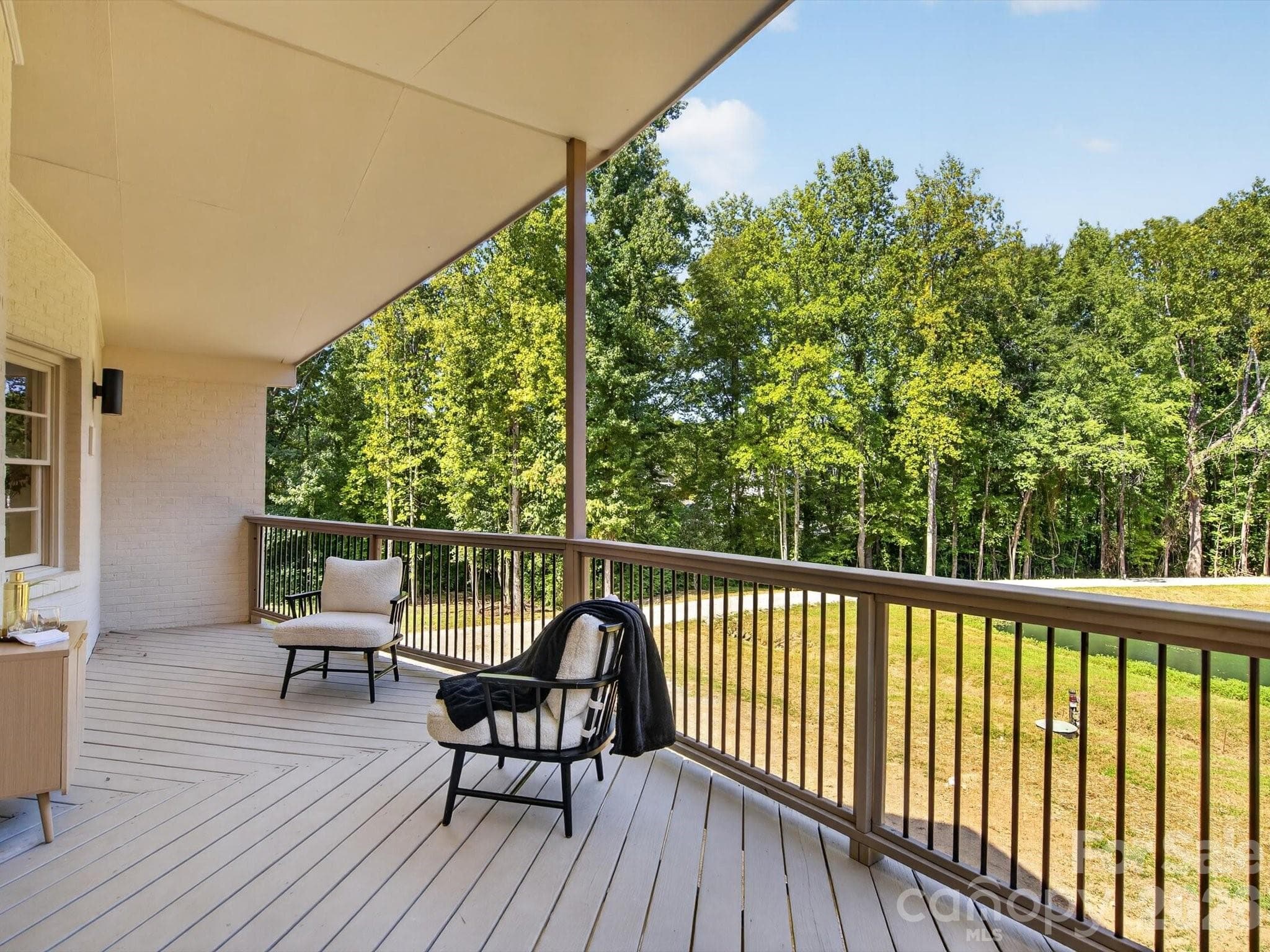 Covered outdoor living with pond views awaits. - 2532 Sam Newell Road, Matthews