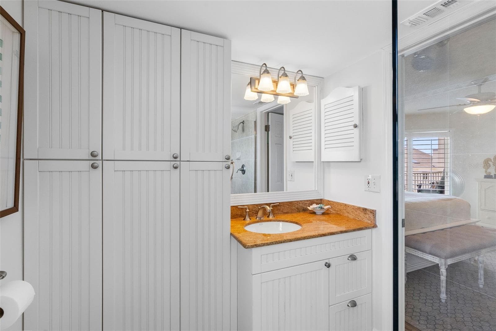Primary Ensuite Bath with custom built cabinetry - 17980 GULF BLVD #401, REDINGTON SHORES