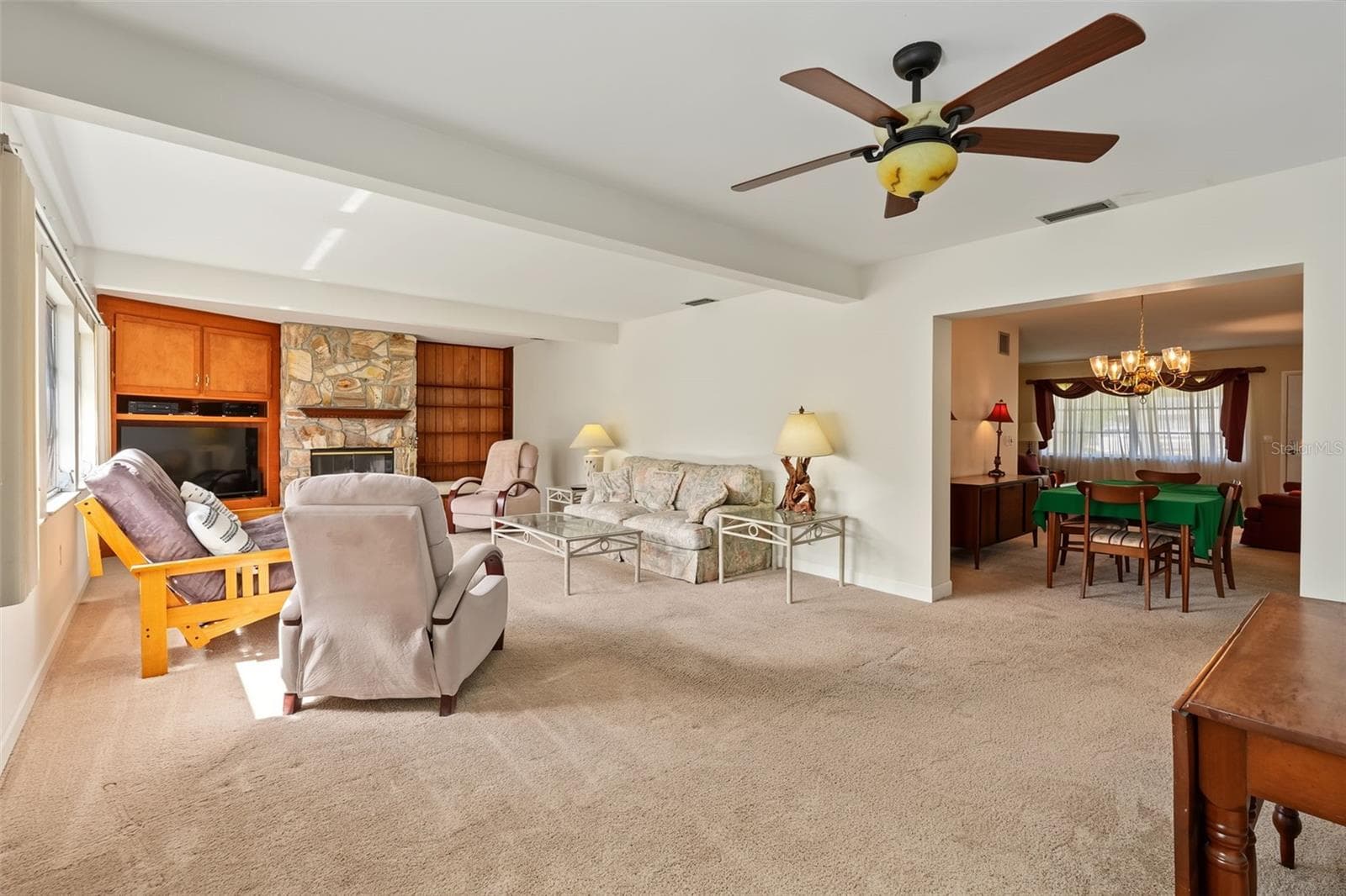 Large family room with a wood burning fireplace. - 981 STEPHEN FOSTER DR, LARGO