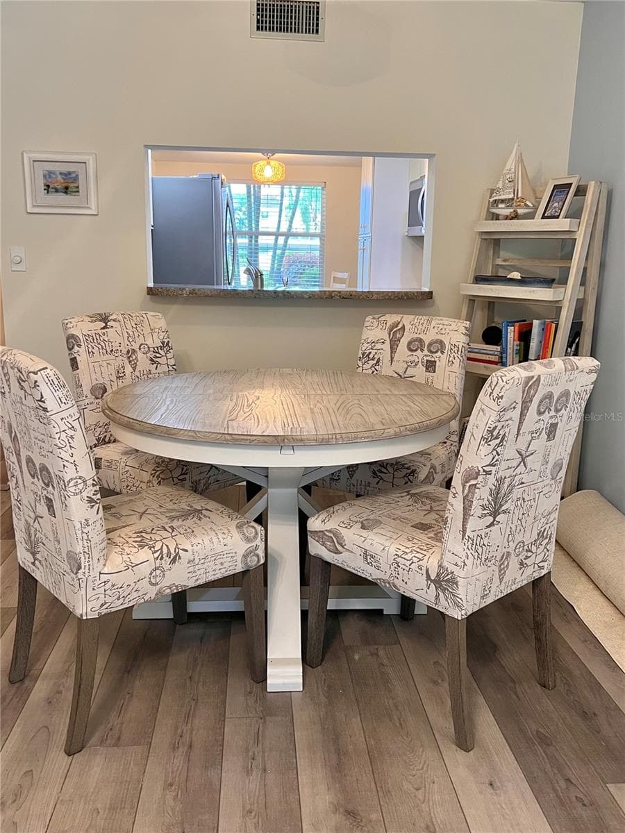 Dining area in the living room (there is a leaf for the table for more guests. - 6501 STONE RIVER RD #104, BRADENTON