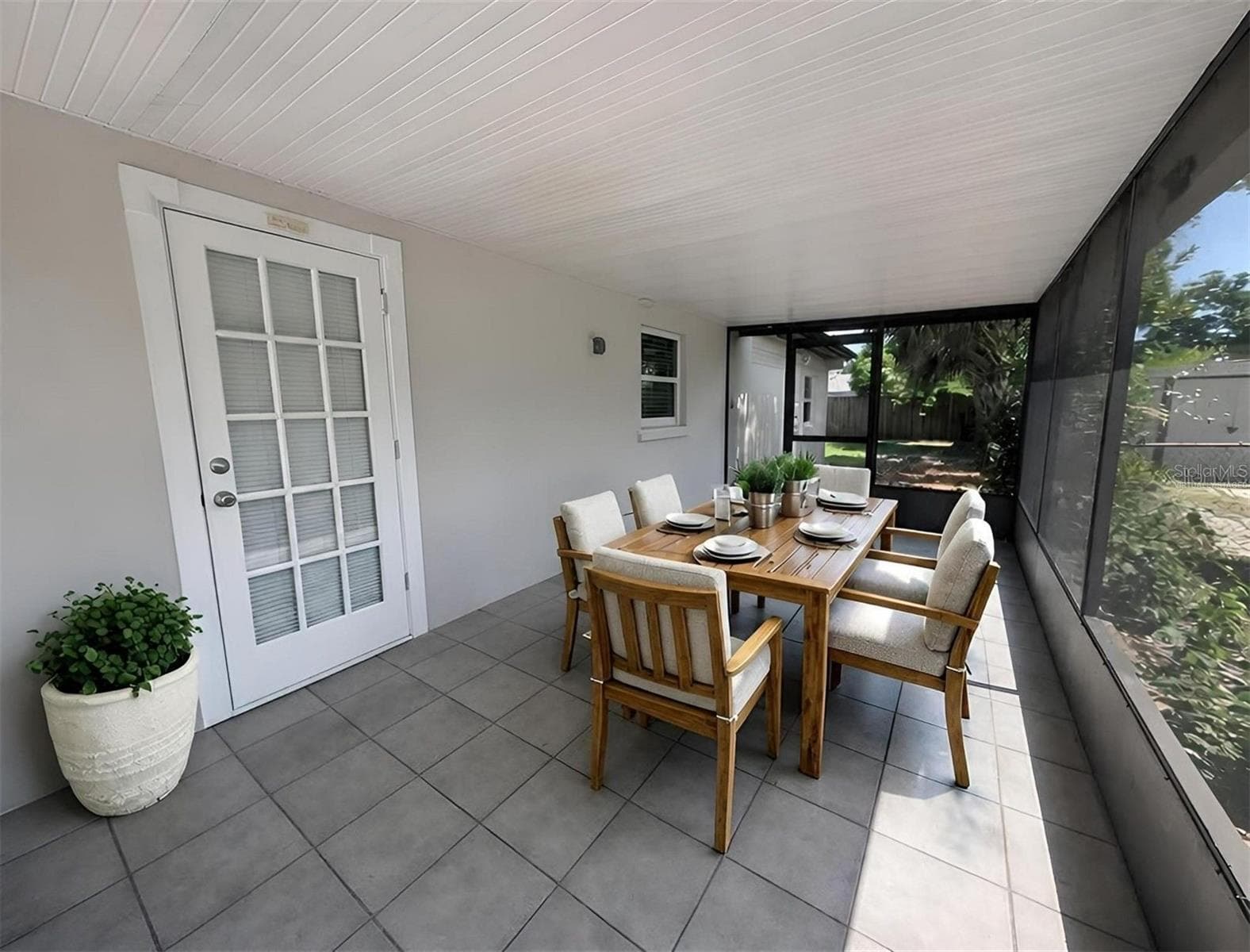 Screen porch virtually staged - 3902 W PAXTON AVE, TAMPA