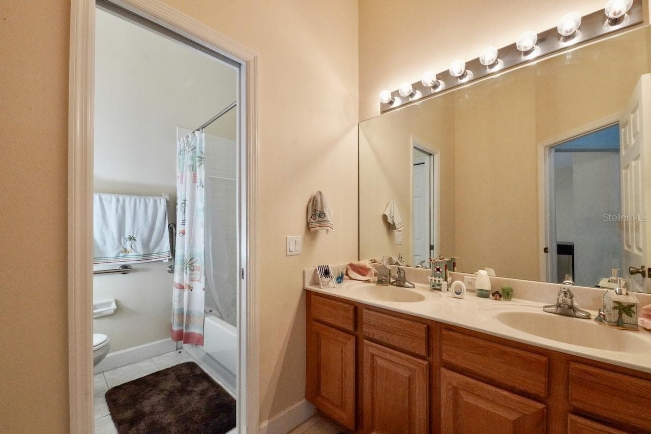 Guest bathroom with dual sinks - 5683 BRACKENWOOD DR, SPRING HILL