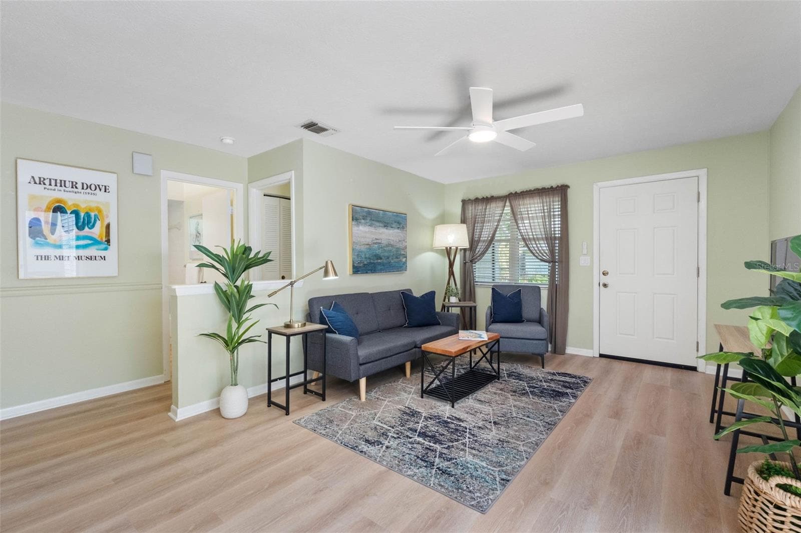 Living room w/luxury viny floors - 2833 ORANGE TREE CIR N #A, PALM HARBOR