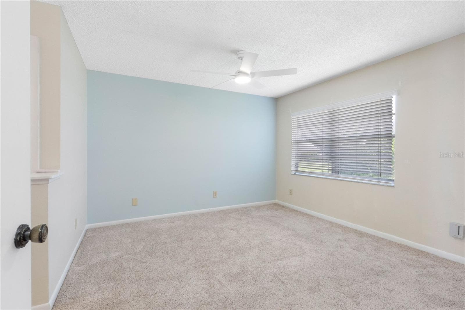 Primary Bedroom with new ceiling fan - 2833 ORANGE TREE CIR N #A, PALM HARBOR
