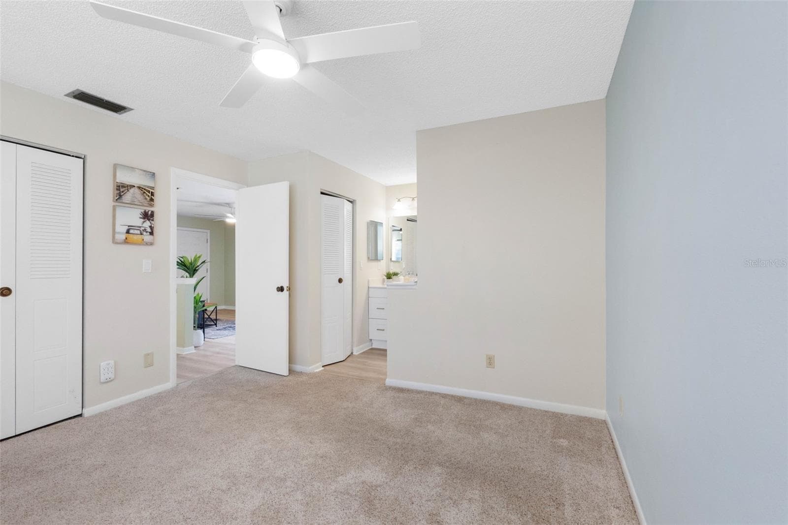 Primary Bedroom with En Suite Bathroom - 2833 ORANGE TREE CIR N #A, PALM HARBOR