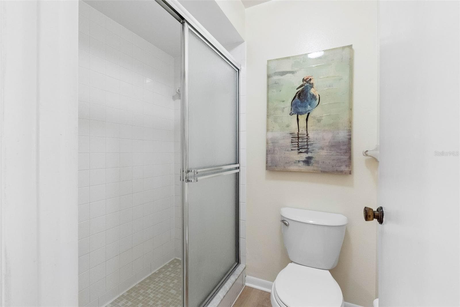 Primary Bathroom Shower and Toilet Area - 2833 ORANGE TREE CIR N #A, PALM HARBOR