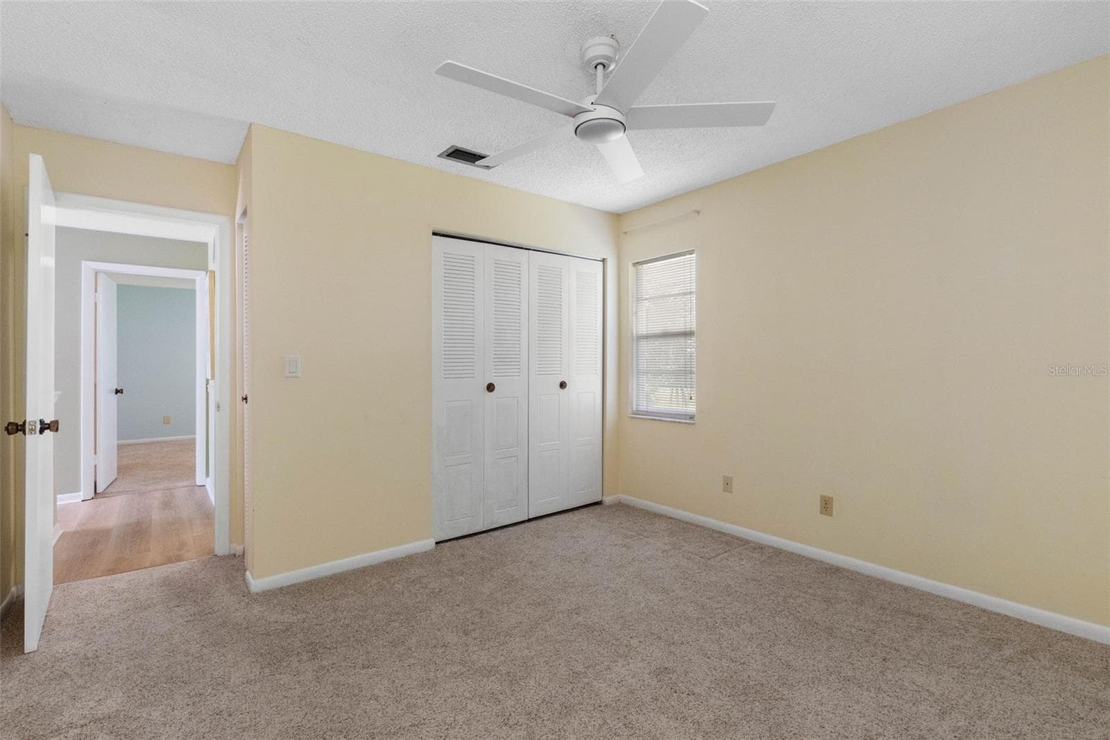 Bedroom 2, with new ceiling fan - 2833 ORANGE TREE CIR N #A, PALM HARBOR