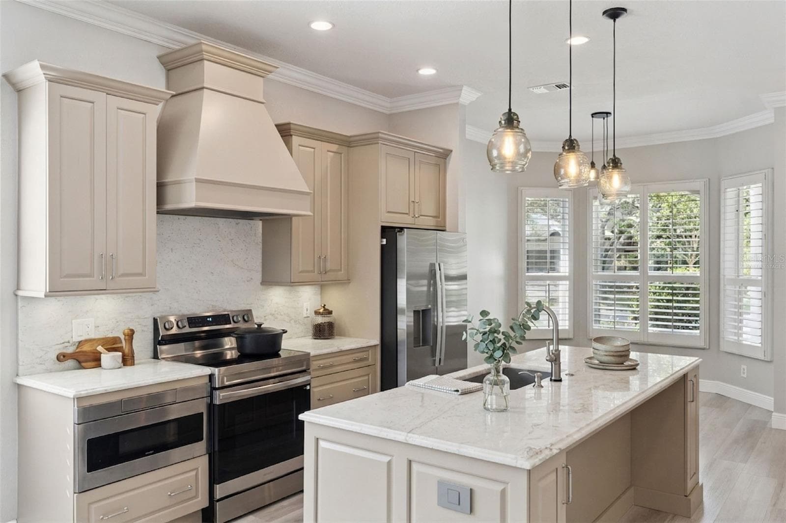 Virtually Staged.  Room for a dinette or desk near the accent windows.  Granite tops in kitchen, new appliances (2026) - 1206 CHESSINGTON CIR, LAKE MARY